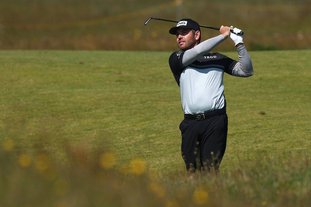 Louis Oosthuizen plays down the fourth hole on his way to an opening day lead at Royal St George